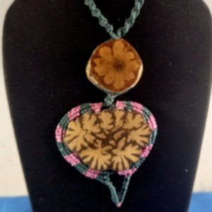Shaman necklace woven in macrame thread and ayahuasca flower